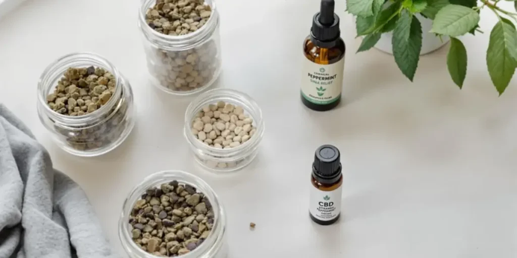 CBD for sinus issues products with peppermint oil and herbal pellets on clean background