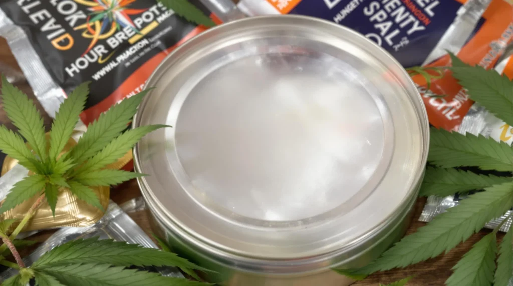 Airtight metal tin with cannabis for secure weed storage.