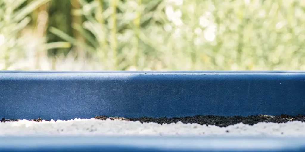 close-up view of rich, dark soil enriched with perlite, prepared for autoflower cannabis planting